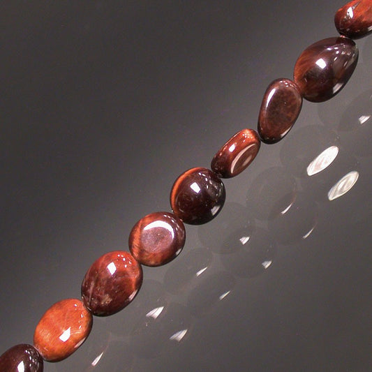 Oeil de taureau, bracelet de 17 à 21cm, collier de 42cm et sautoir de 60cm. Perles de type 'Graine' de formes naturelles montées sur fil de haute résistance !