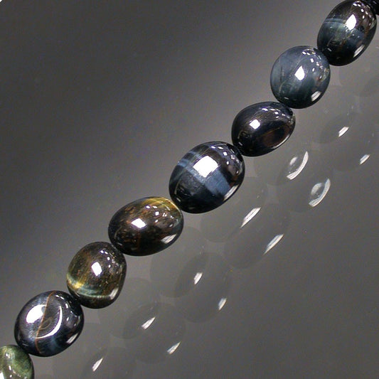 Oeil de faucon, bracelet de 17 à 21cm, collier de 42cm et sautoir de 60cm. Perles de type 'Graine' de formes naturelles montées sur fil de haute résistance !