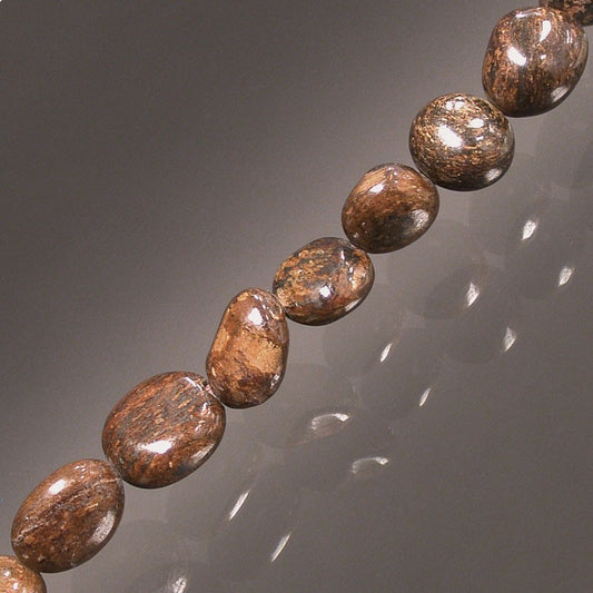 Bronzite, bracelet de 17 à 21cm, collier de 42cm et sautoir de 60cm. Perles de type 'Graine' de formes naturelles montées sur fil de haute résistance !