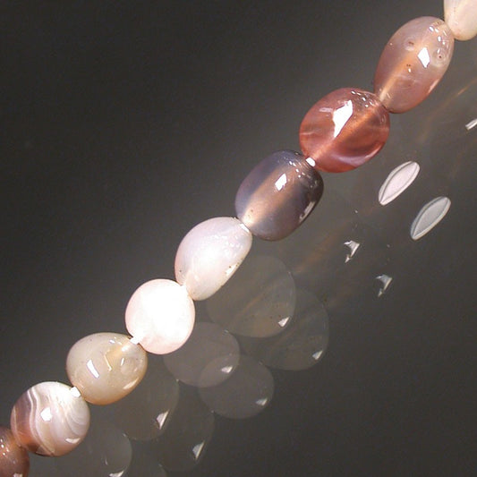 Natural agate, 17 to 21cm bracelet, 42cm necklace and 60cm sautoir. Naturally shaped 'Seed' type beads mounted on high-strength wire!