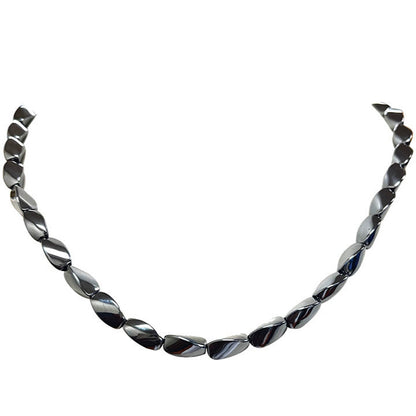 Hématite, perles 'Twist' de 8 x 6 millimètres, vendu en fil de perle, en bracelet de 17 à 21 cm, ou en collier de 42 cm. 3 finitions au choix pour le système de fermeture (Argent, plaqué or, argenté) !