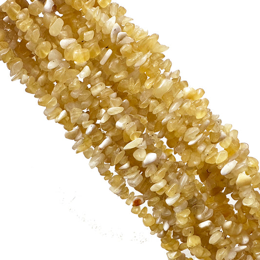 Calcite orange, bracelet de 17 à 21cm, collier de 42cm et sautoir de 60cm. Perles de type 'Graine' de formes naturelles montées sur fil de haute résistance !
