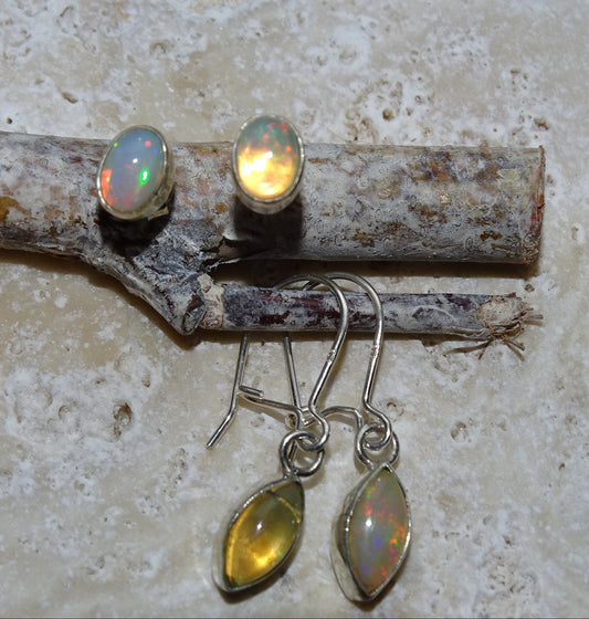 AA to AAA quality Welo Opal Stud Earrings by Gem &amp; Zen. These stunning cabochon stones are set in 925 sterling silver, with mesmerizing reflections. Perfect!