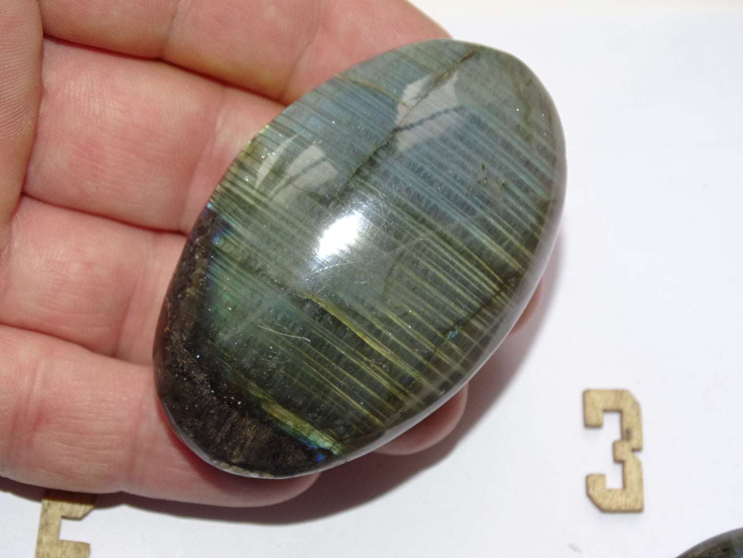 Labradorite, a selection of pebbles/flat stones, in a choice of designs, approximately 6x4x1.5 cm. A good size for massage stones. Very high quality, with incredible hologram reflections, perfect!