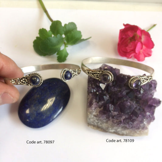 1 centimeter wide 'Cuff' type bracelet, made of silver-plated brass with Amethyst or lapis lazuli cabochons.