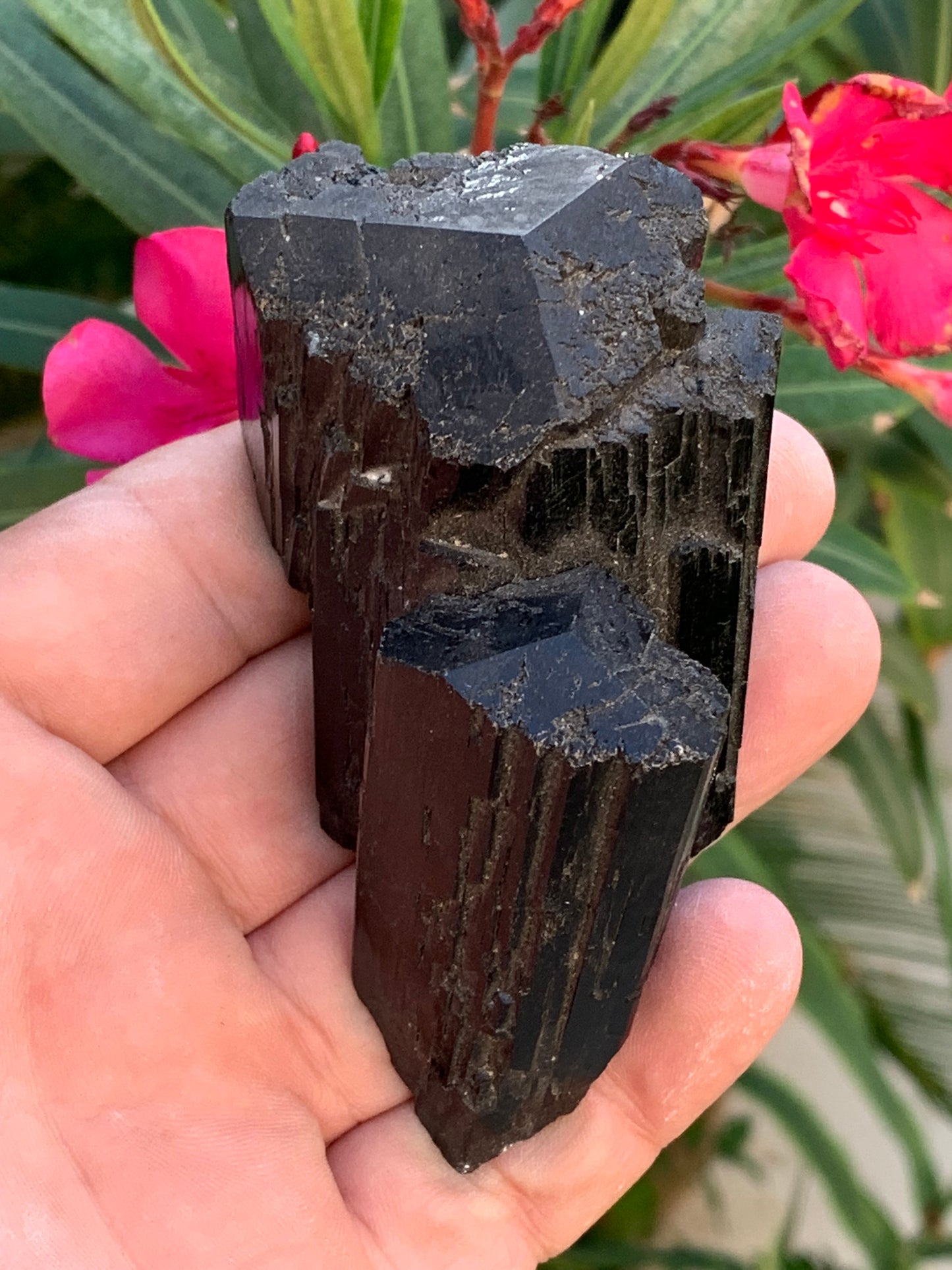 Black tourmaline, natural specimen, twin of 92 x 65 x 50 mm - 263.8 grams. A very beautiful piece with several 3-sided heads! 