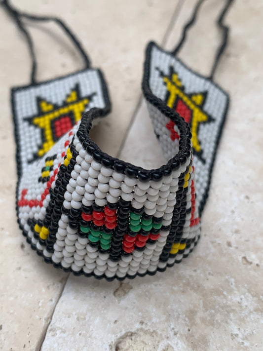 Beautiful 2mm glass seed bead bracelet. 18.5 centimeters long. Suitable for ankles or wrists. Beautiful authentic designs! Made by Native Americans in Quebec (Earth Tribe)...