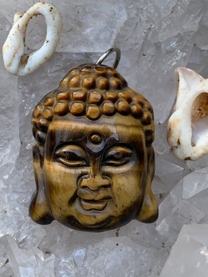 Bouddha, pendentif réalisé à 100% en oeil de tigre de 30 x 22 x 10 millimètres. Livré avec cordon coulissant (offert), prêt à porté ou à offrir, parfait !