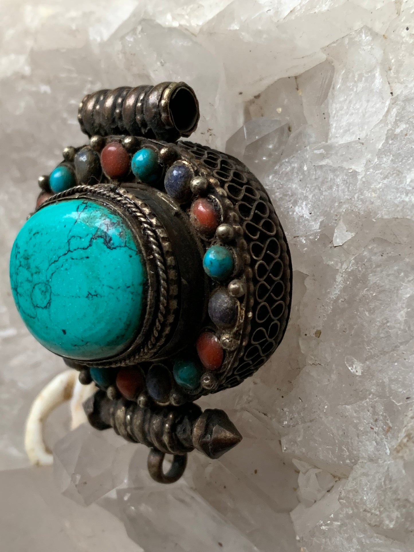 Handcrafted pendant/reliquary from Nepal with turquoise and coral stones set in metal! 48 millimeters high x 37 mm wide x 18 mm thick. Sold with a free adjustable black cord, perfect!
