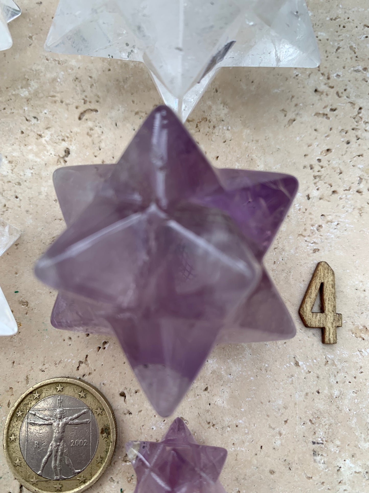 Etoile de Sirius (12 branches) en cristal de roche/ quartz et améthyste. Modèle au choix vendu à l'unité, de 1,5 à 6 cm. Parfait pour l'étude de la géométrie sacré et ses applications !