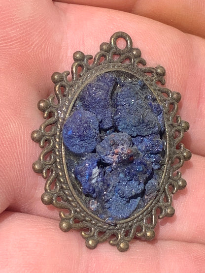 Azurite, bronze-colored brass pendant with beautiful natural crystals, 37mm high x 30 wide x 8 thick. Sold with a free adjustable black cord!