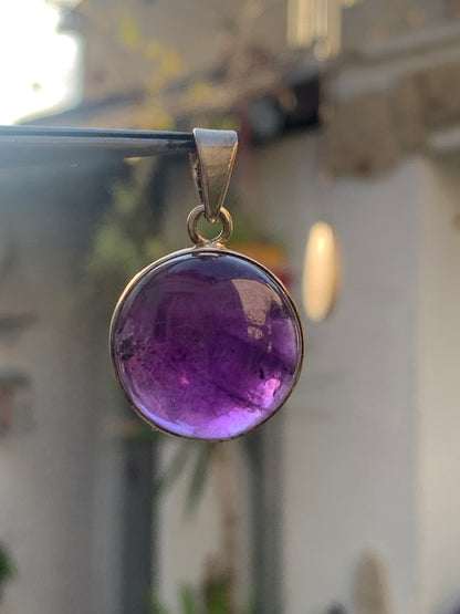 Amethyst, Silver pendant, 34 mm high x 22 mm wide x 10 mm thick. Sold with a free adjustable black cord!