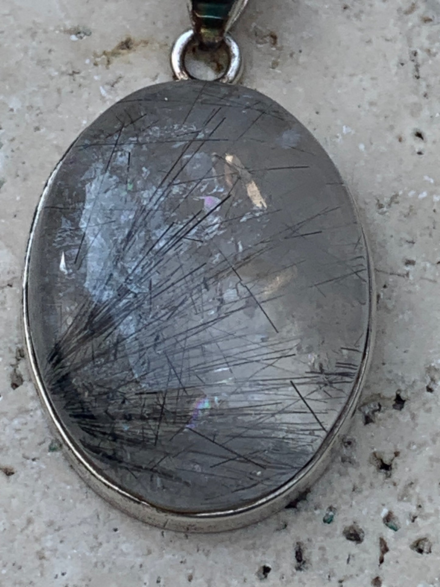 Rock crystal/quartz with black tourmaline inclusions! Silver pendant, 43 mm high x 25 mm wide x 10 mm thick. Sold with an adjustable black cord!