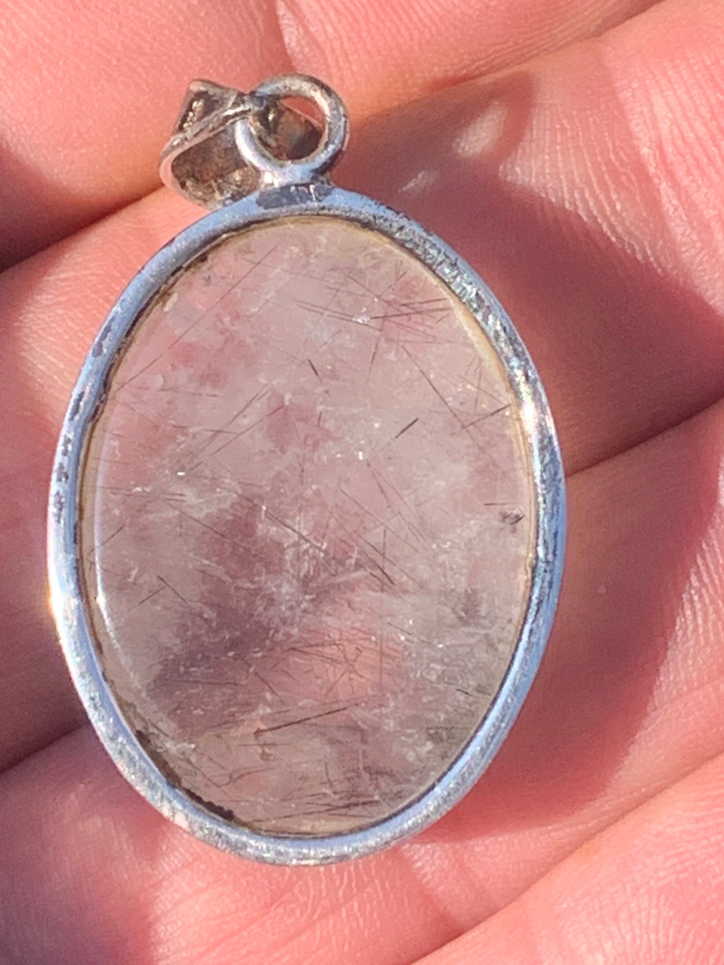 Rock crystal/quartz with black tourmaline inclusions! Silver pendant, 43 mm high x 25 mm wide x 10 mm thick. Sold with an adjustable black cord!