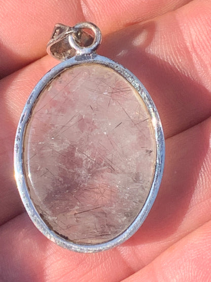 Rock crystal/quartz with black tourmaline inclusions! Silver pendant, 43 mm high x 25 mm wide x 10 mm thick. Sold with an adjustable black cord!