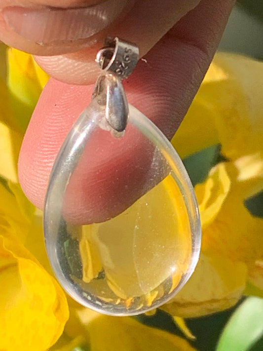 Rock crystal/quartz, AAA quality silver 'drop' pendant, 40mm high x 20mm wide x 9mm thick. Sold with an adjustable black cord! A crystal jewel, for those who love to walk between light and mystery!
