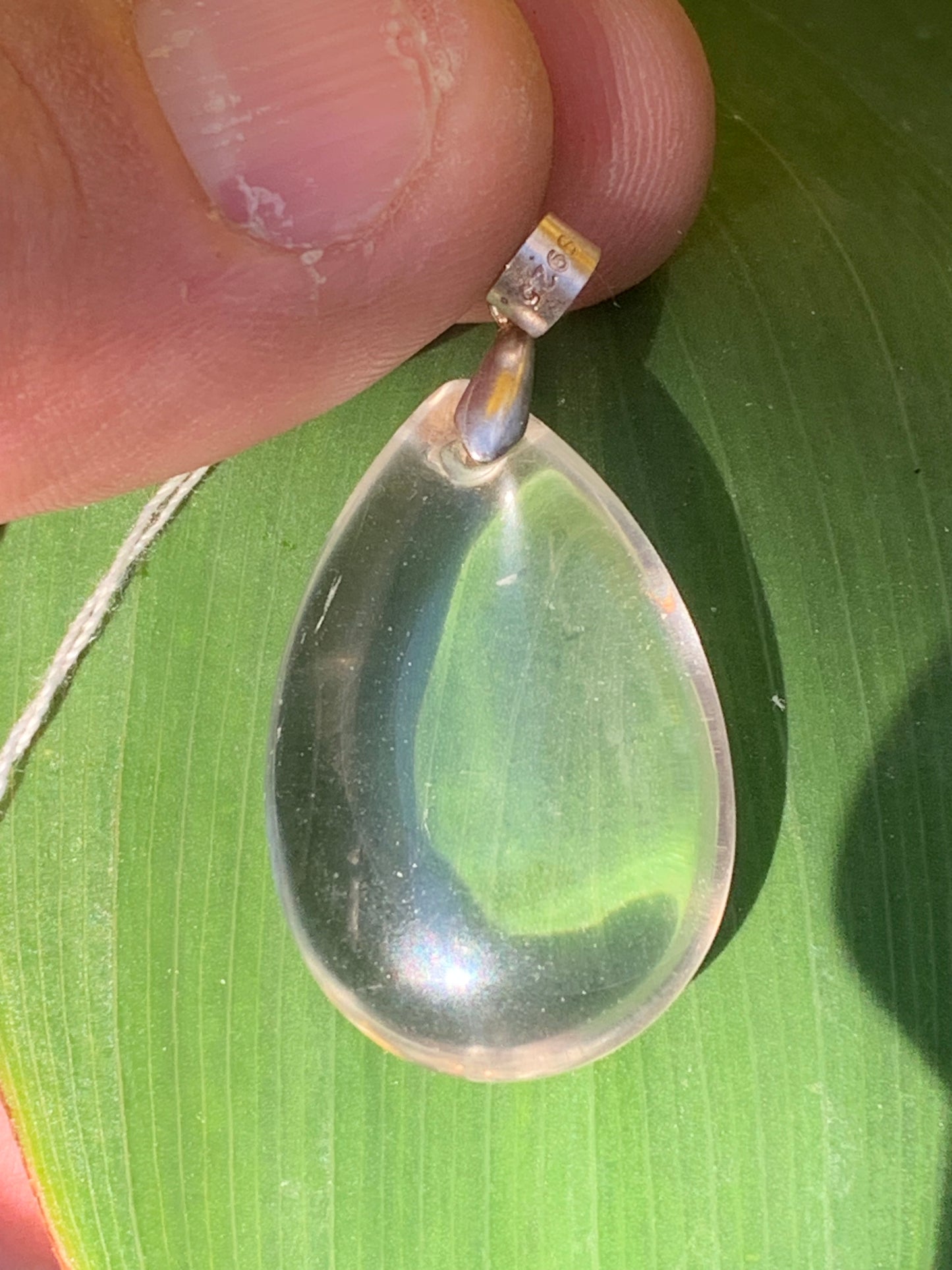 Rock crystal/quartz, AAA quality silver 'drop' pendant, 40mm high x 20mm wide x 9mm thick. Sold with an adjustable black cord! A crystal jewel, for those who love to walk between light and mystery!