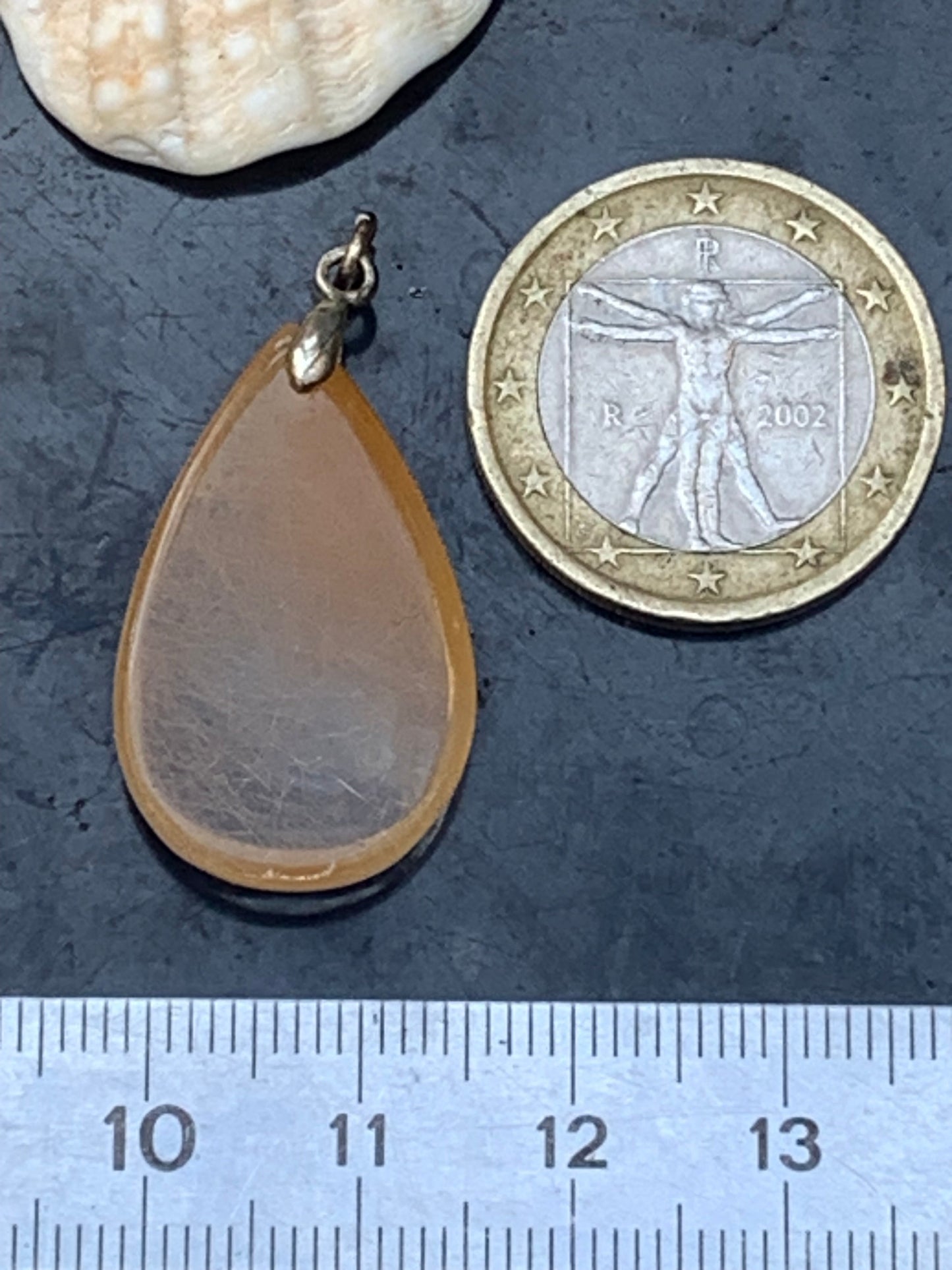 Rock crystal/quartz with golden rutile inclusions! Silver pendant, 33 mm high x 18 mm wide x 5 mm thick. Sold with an adjustable black cord!