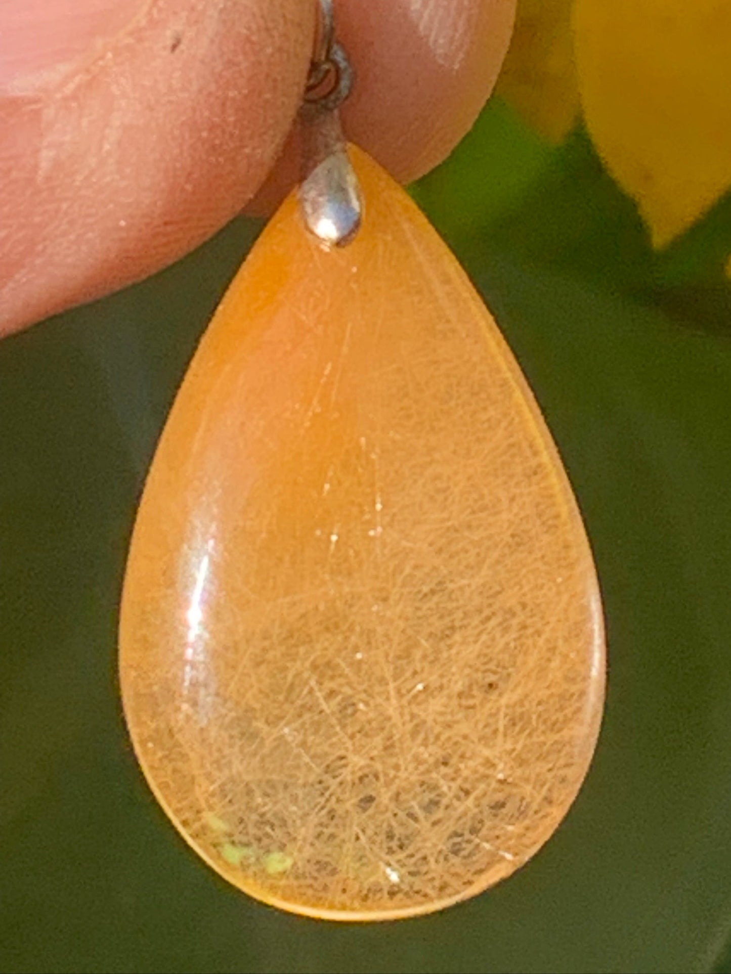Rock crystal/quartz with golden rutile inclusions! Silver pendant, 33 mm high x 18 mm wide x 5 mm thick. Sold with an adjustable black cord!