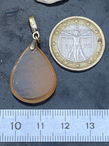 Rock crystal/quartz with golden rutile inclusions! Silver pendant, 40 mm high x 20 mm wide x 5 mm thick. Sold with an adjustable black cord!