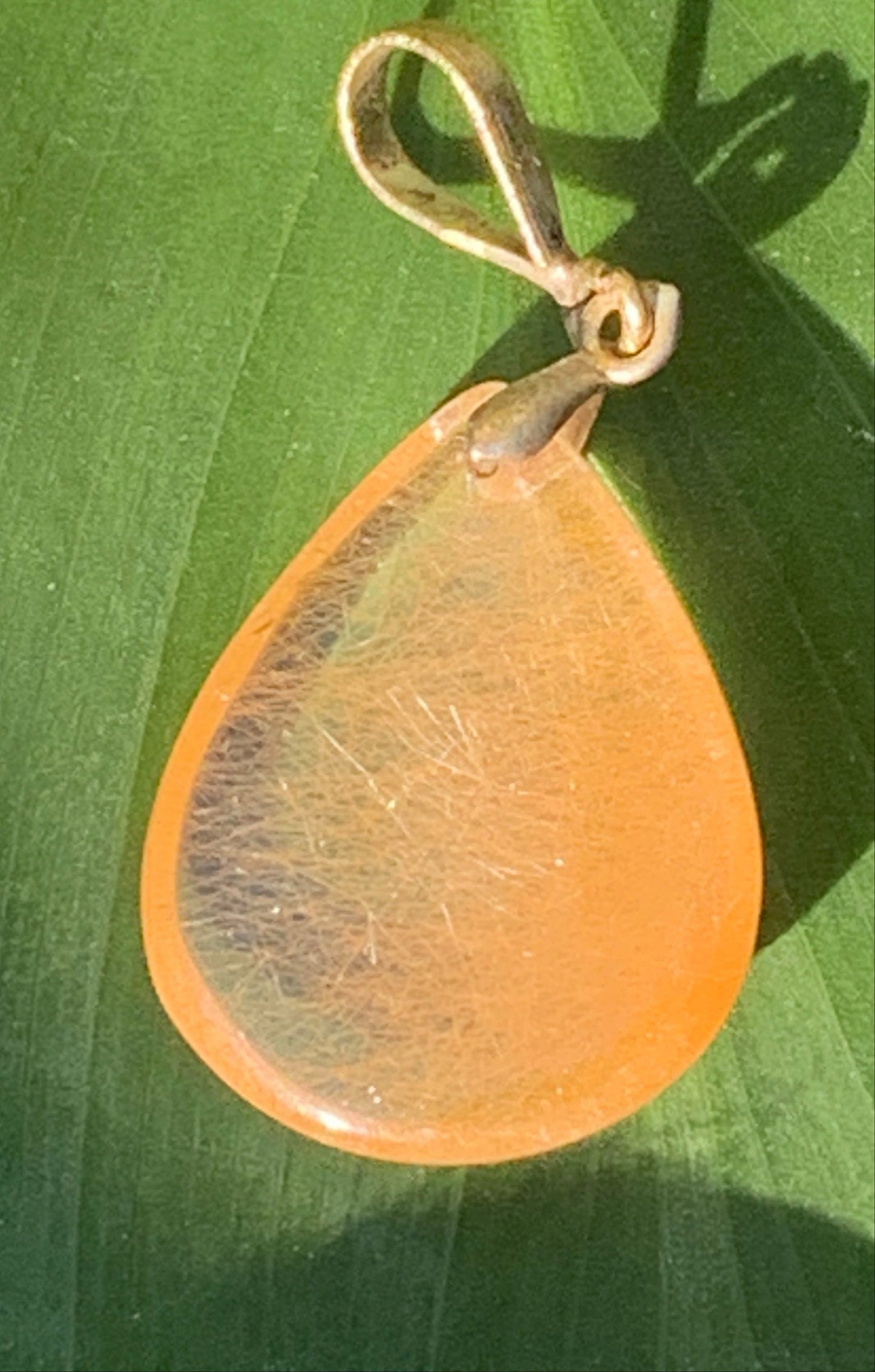 Rock crystal/quartz with golden rutile inclusions! Silver pendant, 40 mm high x 20 mm wide x 5 mm thick. Sold with an adjustable black cord!
