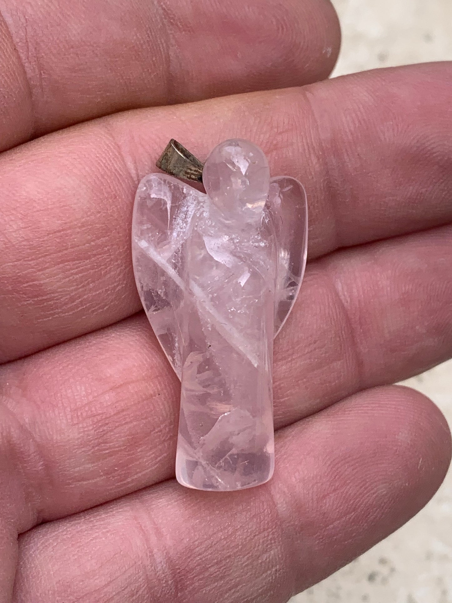 Rock crystal/Rose quartz! 'Angel' pendant measuring 40mm high x 18mm wide x 14mm thick. Sold with an adjustable black cord!