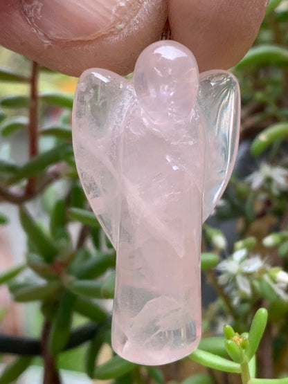 Rock crystal/Rose quartz! 'Angel' pendant measuring 40mm high x 18mm wide x 14mm thick. Sold with an adjustable black cord!