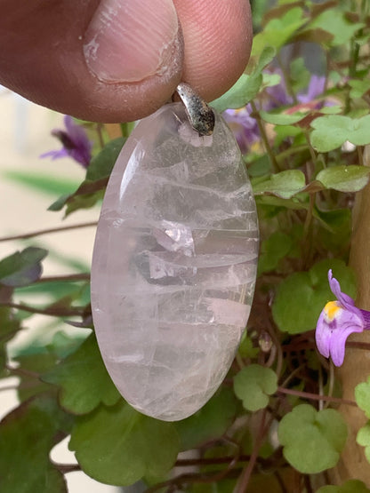 Rock crystal/Rose quartz! Pendant measuring 50mm high x 28mm wide x 8mm thick. Sold with an adjustable black cord!