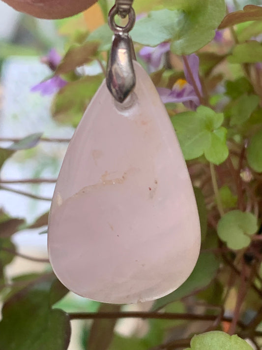 Rock crystal/Rose quartz! Pendant measuring 43mm high x 20mm wide x 8mm thick. Sold with an adjustable black cord!