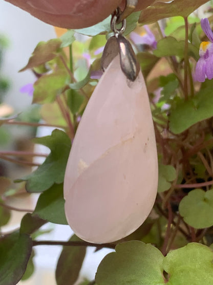 Rock crystal/Rose quartz! Pendant measuring 43mm high x 20mm wide x 8mm thick. Sold with an adjustable black cord!