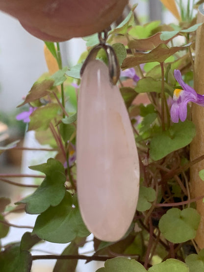 Rock crystal/Rose quartz! Pendant measuring 43mm high x 20mm wide x 8mm thick. Sold with an adjustable black cord!
