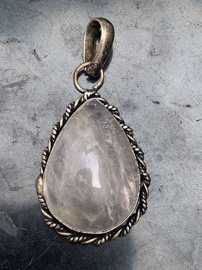 Rock crystal/Rose quartz! Pendant measuring 44mm high x 23mm wide x 12mm thick. Sold with an adjustable black cord!