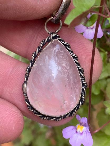 Rock crystal/Rose quartz! Pendant measuring 44mm high x 23mm wide x 12mm thick. Sold with an adjustable black cord!