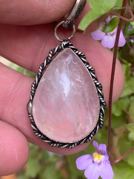 Rock crystal/Rose quartz! Pendant measuring 44mm high x 23mm wide x 12mm thick. Sold with an adjustable black cord!