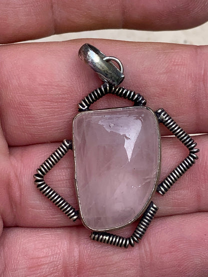 Rock crystal/Rose quartz! Pendant measuring 50mm high x 35mm wide x 10mm thick. Sold with an adjustable black cord!