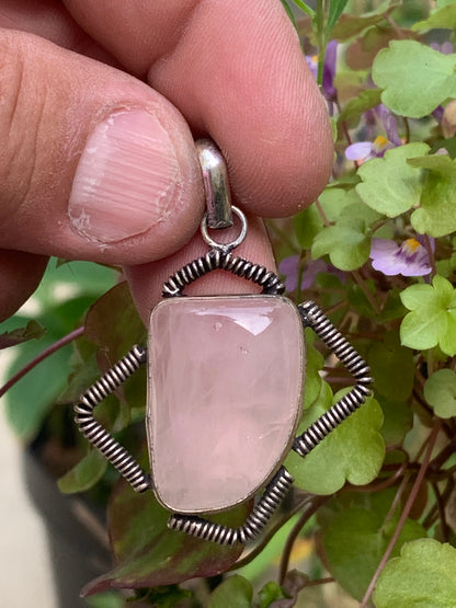Rock crystal/Rose quartz! Pendant measuring 50mm high x 35mm wide x 10mm thick. Sold with an adjustable black cord!
