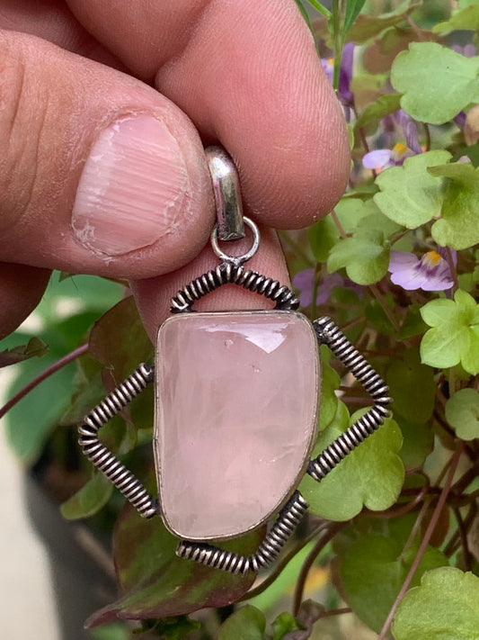 Rock crystal/Rose quartz! Pendant measuring 50mm high x 35mm wide x 10mm thick. Sold with an adjustable black cord!