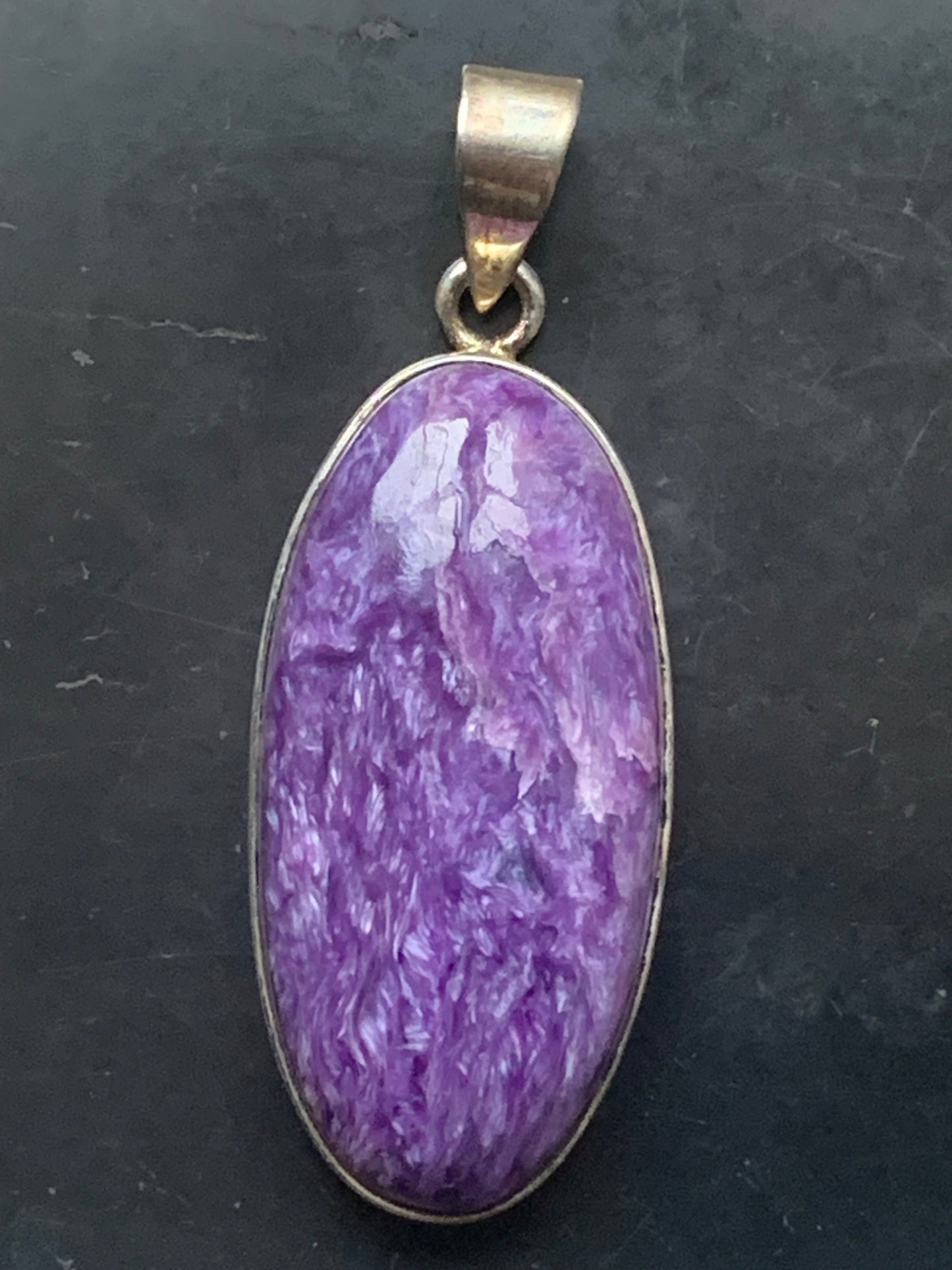 Charoite, magnificent 925 Silver pendant measuring 50mm high x 19mm wide x 9mm thick. Sold with an adjustable black cord!