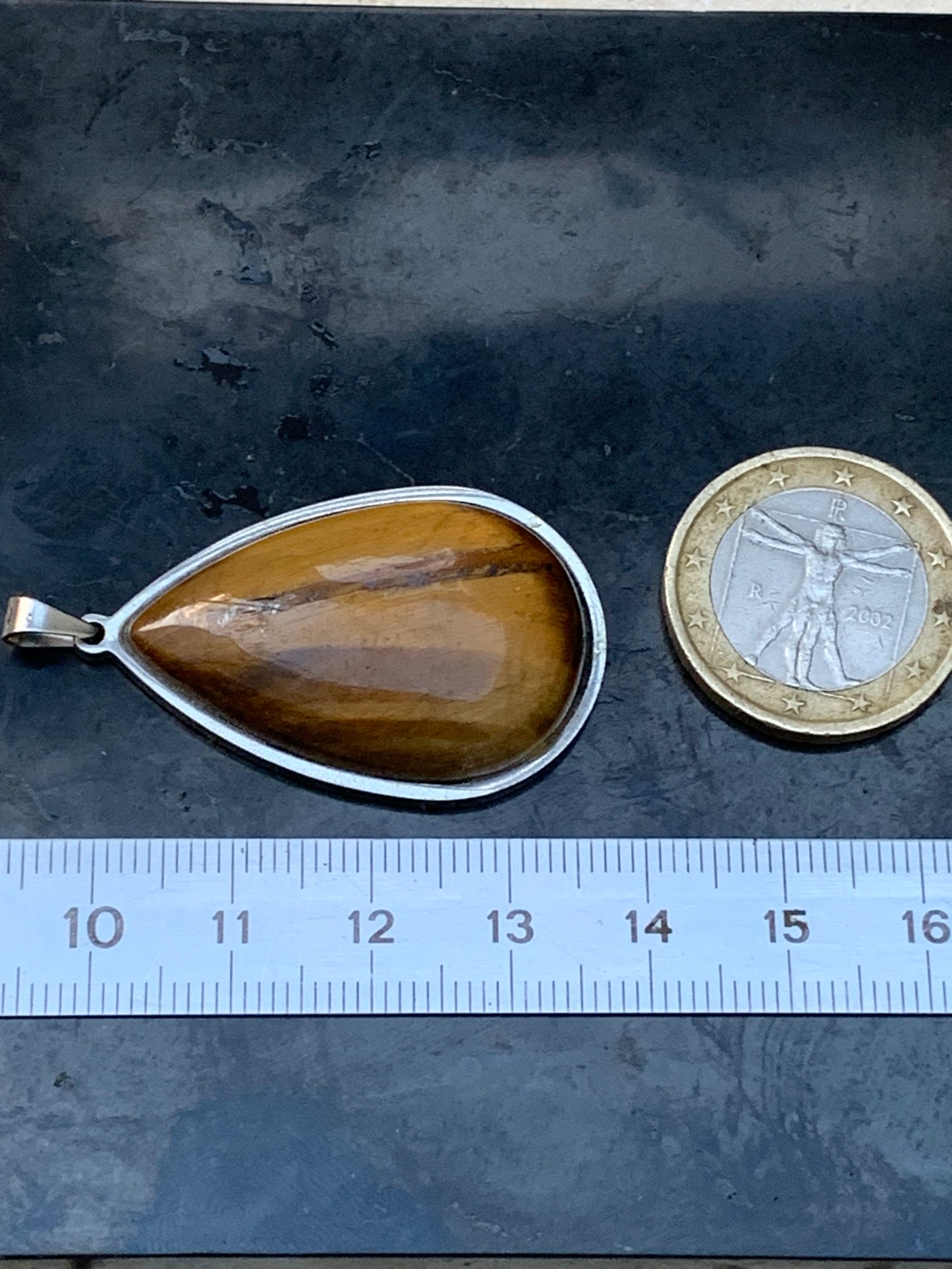 Tiger's Eye, pendant measuring 45mm high x 25mm wide x 8mm thick. Sold with a free adjustable black cord!
