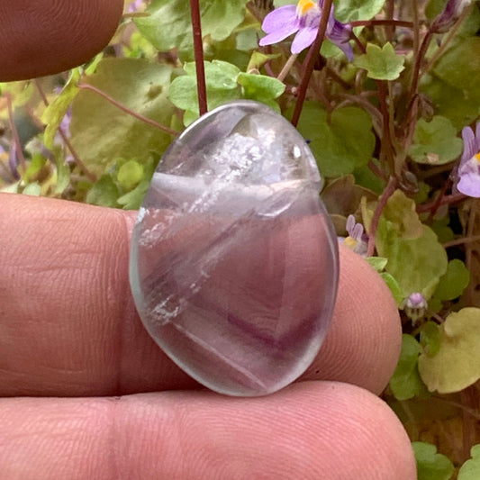Multicolored fluorite, side-drilled pebble measuring 28 millimeters x 20 x 10. Sold with an adjustable black cord!