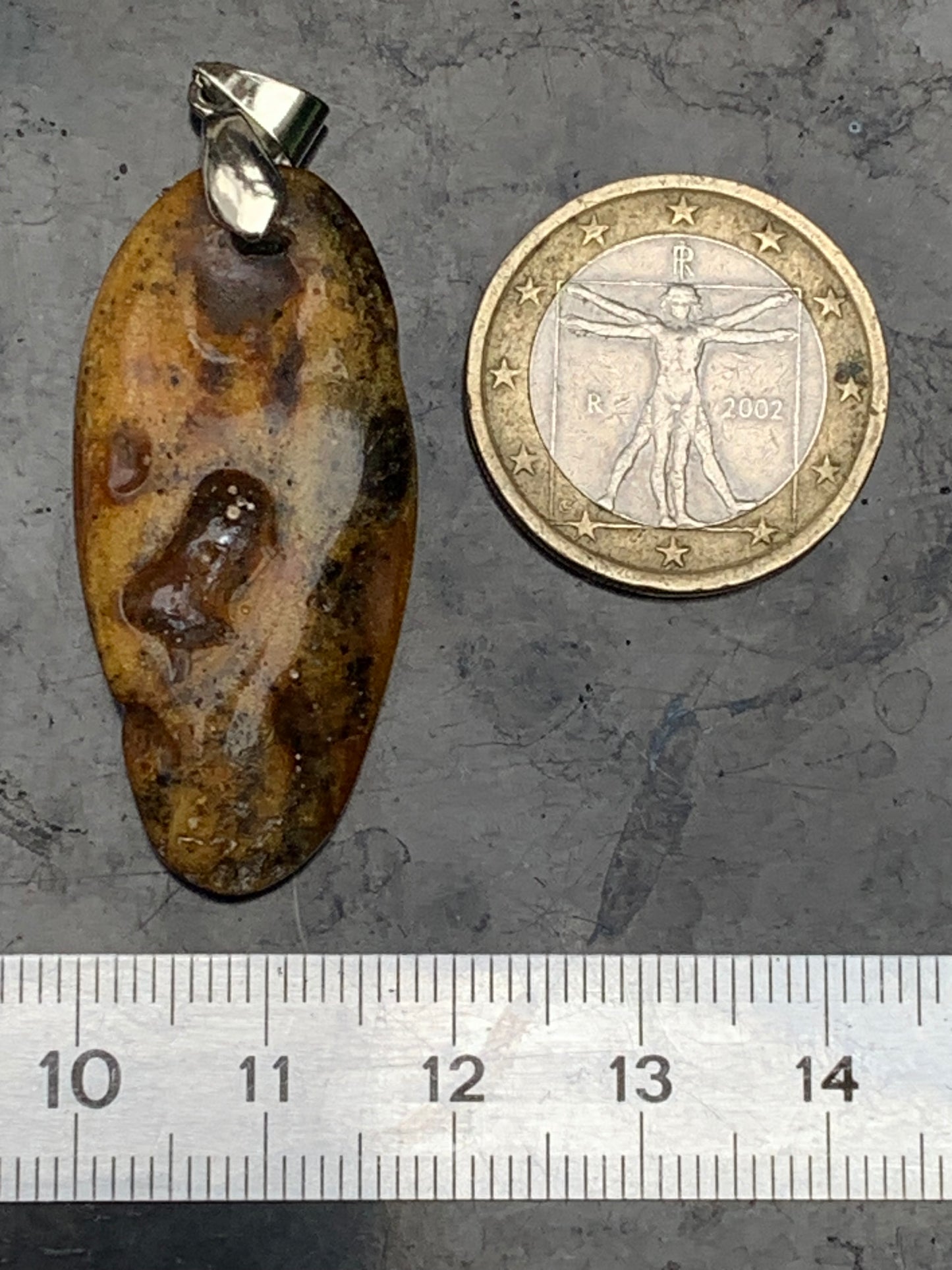 Amber, pendant measuring 50x18x10 millimeters, sold with a sliding (adjustable) black leather cord measuring 40 to 70 centimeters!