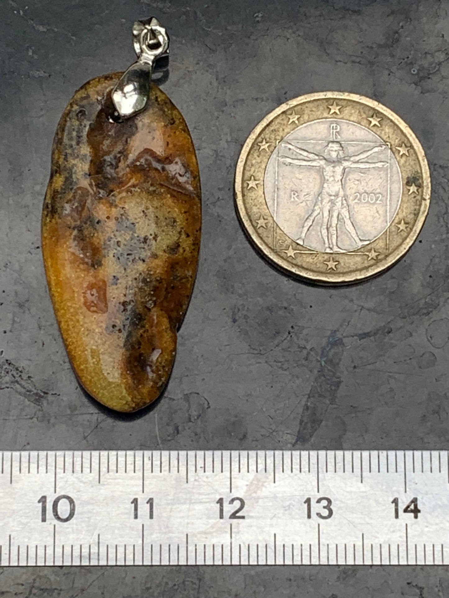Amber, pendant measuring 50x18x10 millimeters, sold with a sliding (adjustable) black leather cord measuring 40 to 70 centimeters!