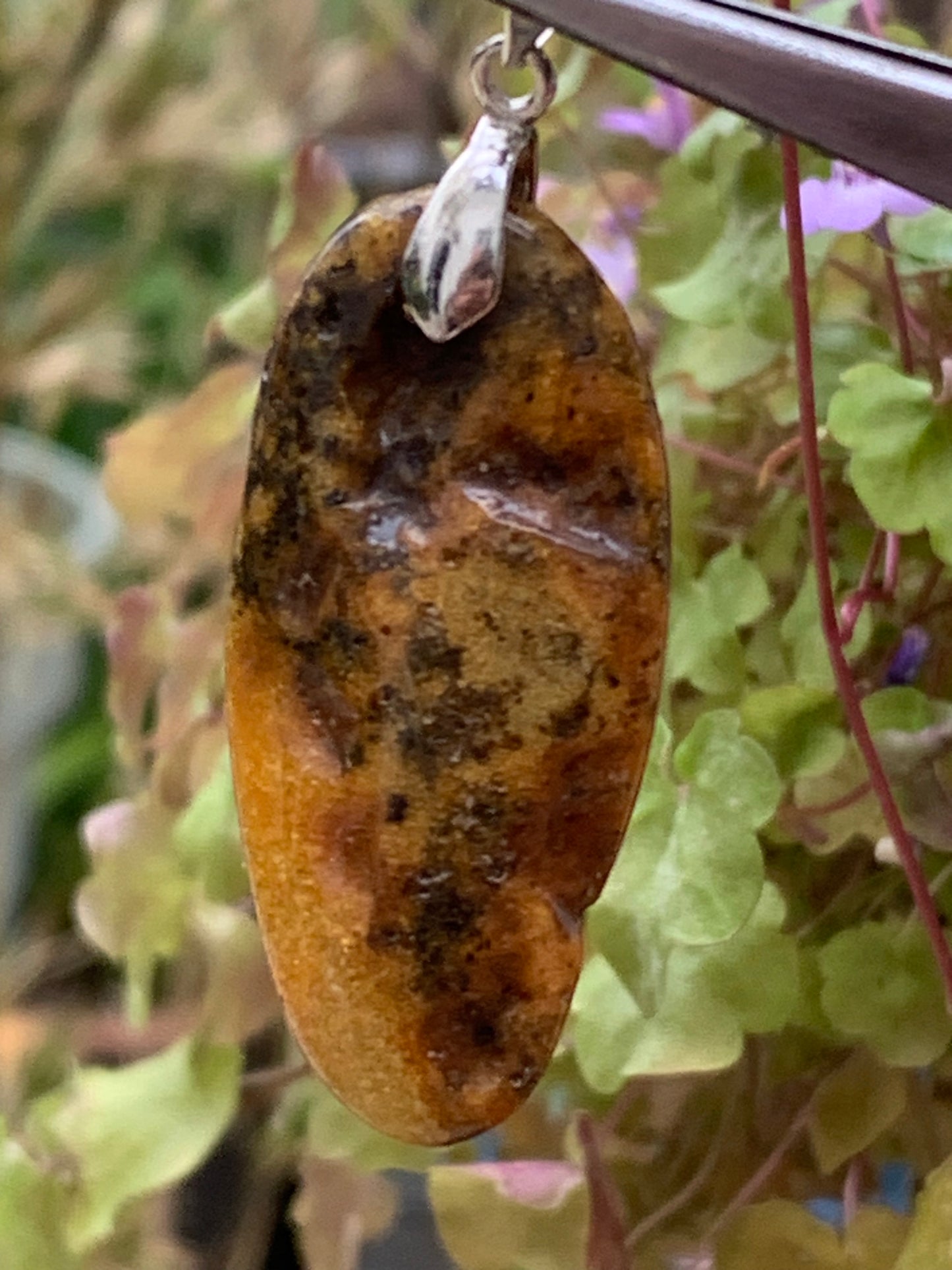 Amber, pendant measuring 50x18x10 millimeters, sold with a sliding (adjustable) black leather cord measuring 40 to 70 centimeters!
