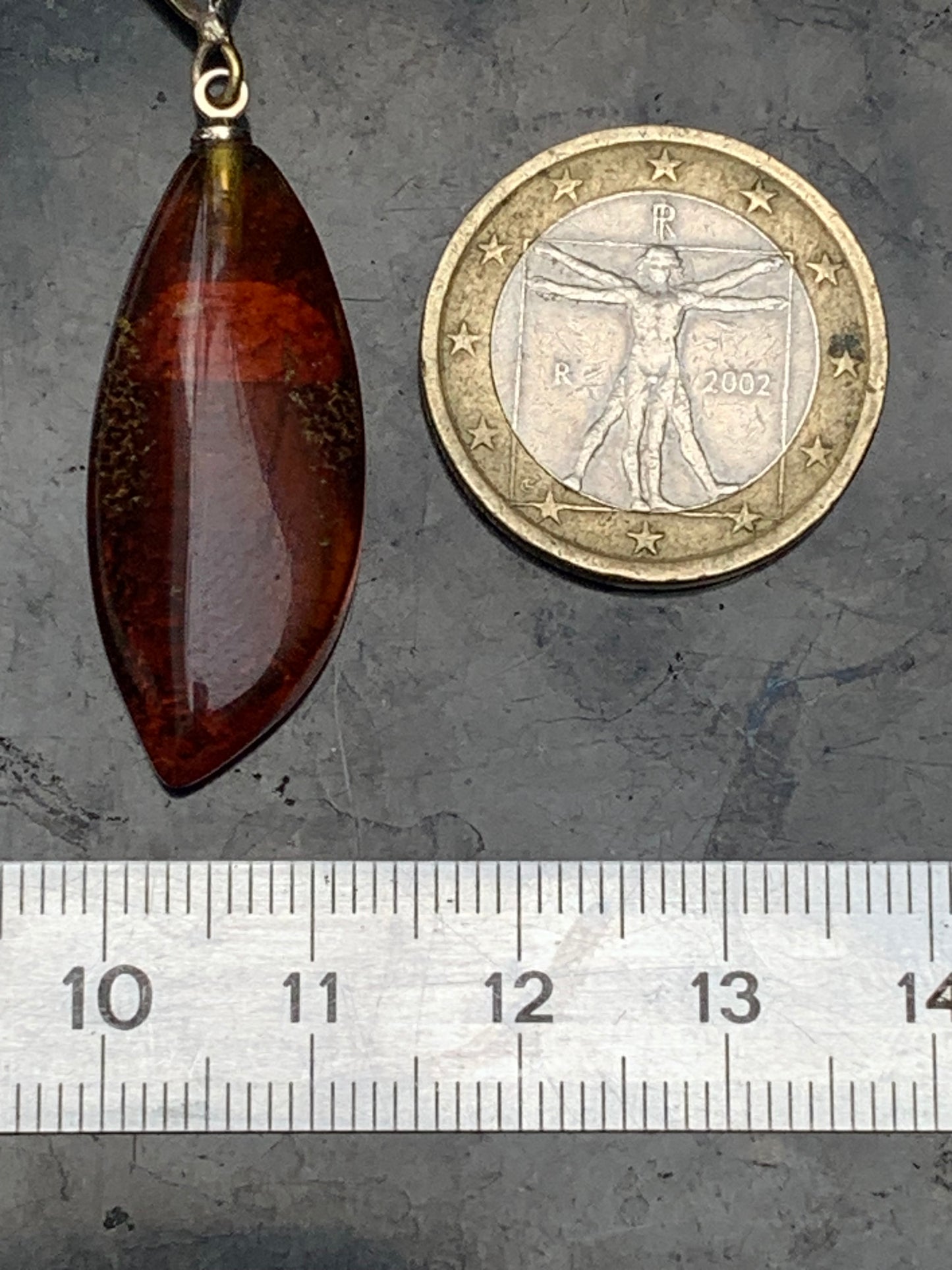 Amber, pendant measuring 40x13x9 millimeters, sold with a sliding (adjustable) black leather cord from 40 to 70 centimeters!