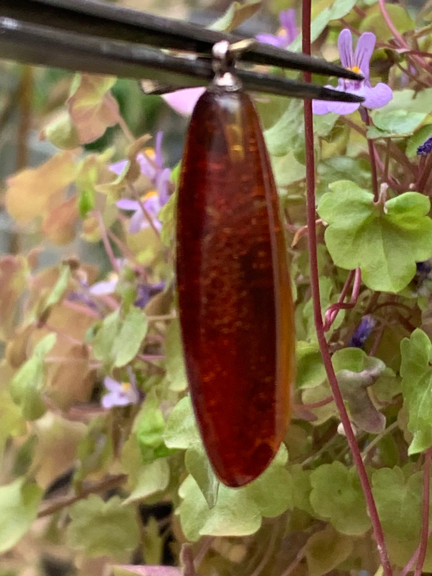 Amber, pendant measuring 40x13x9 millimeters, sold with a sliding (adjustable) black leather cord from 40 to 70 centimeters!