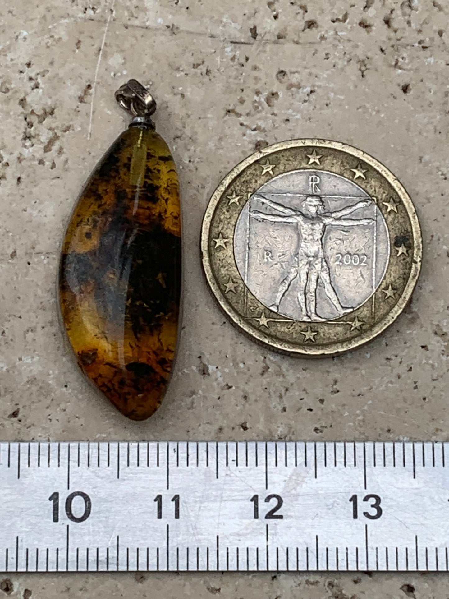 Amber, pendant measuring 40x13x9 millimeters, sold with a sliding (adjustable) black leather cord from 40 to 70 centimeters!
