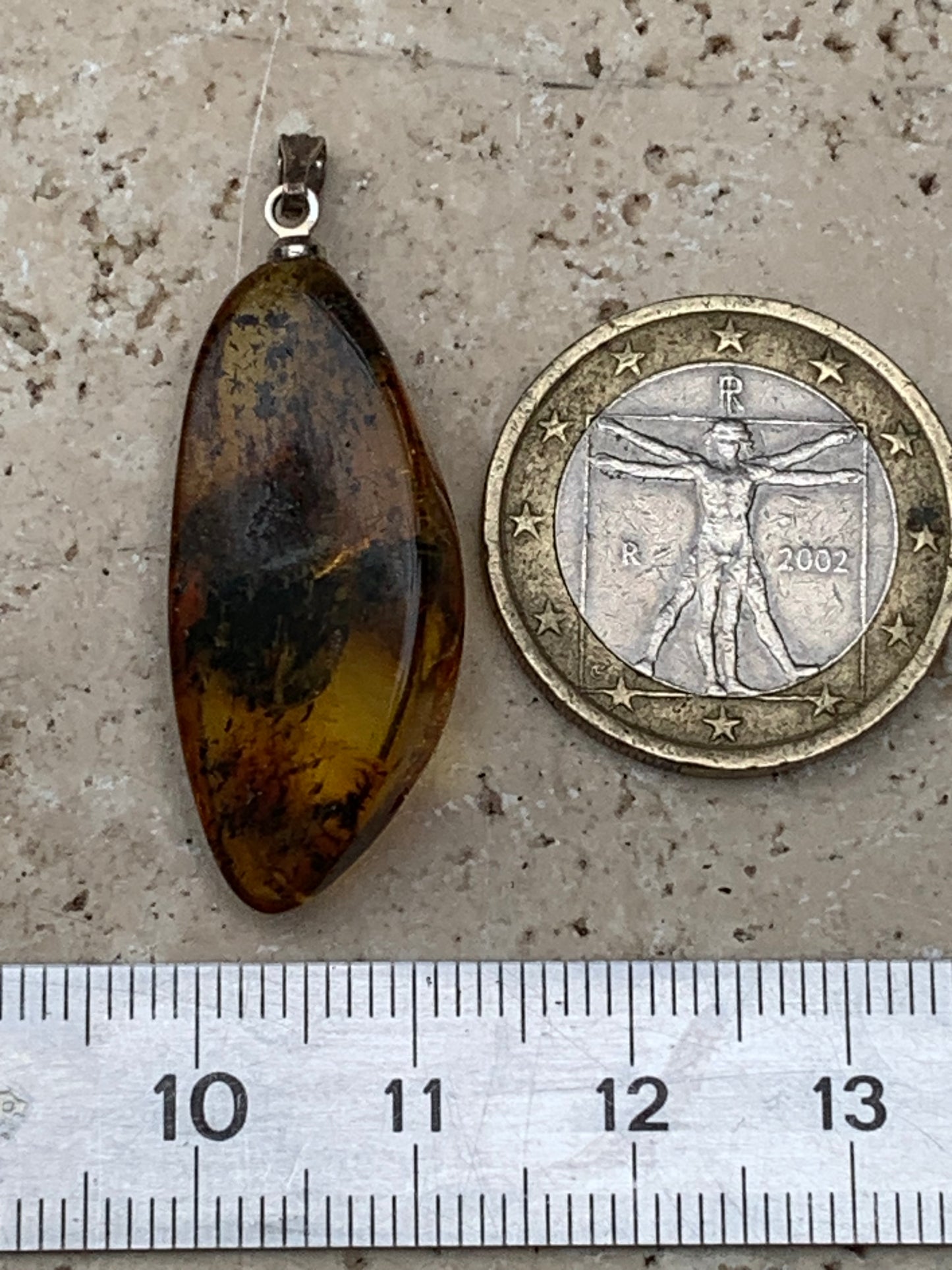 Amber, pendant measuring 40x13x9 millimeters, sold with a sliding (adjustable) black leather cord from 40 to 70 centimeters!