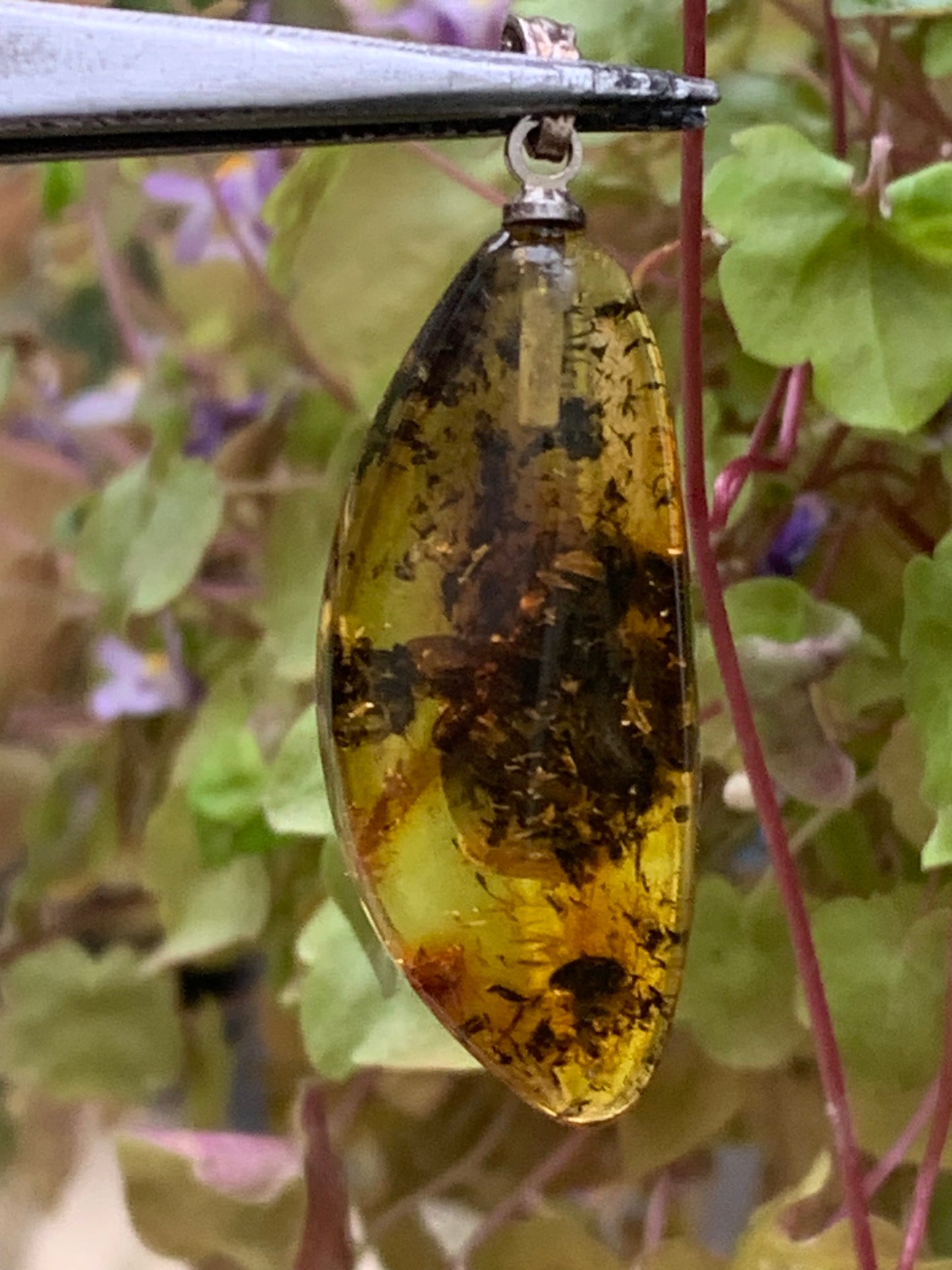 Amber, pendant measuring 40x13x9 millimeters, sold with a sliding (adjustable) black leather cord from 40 to 70 centimeters!