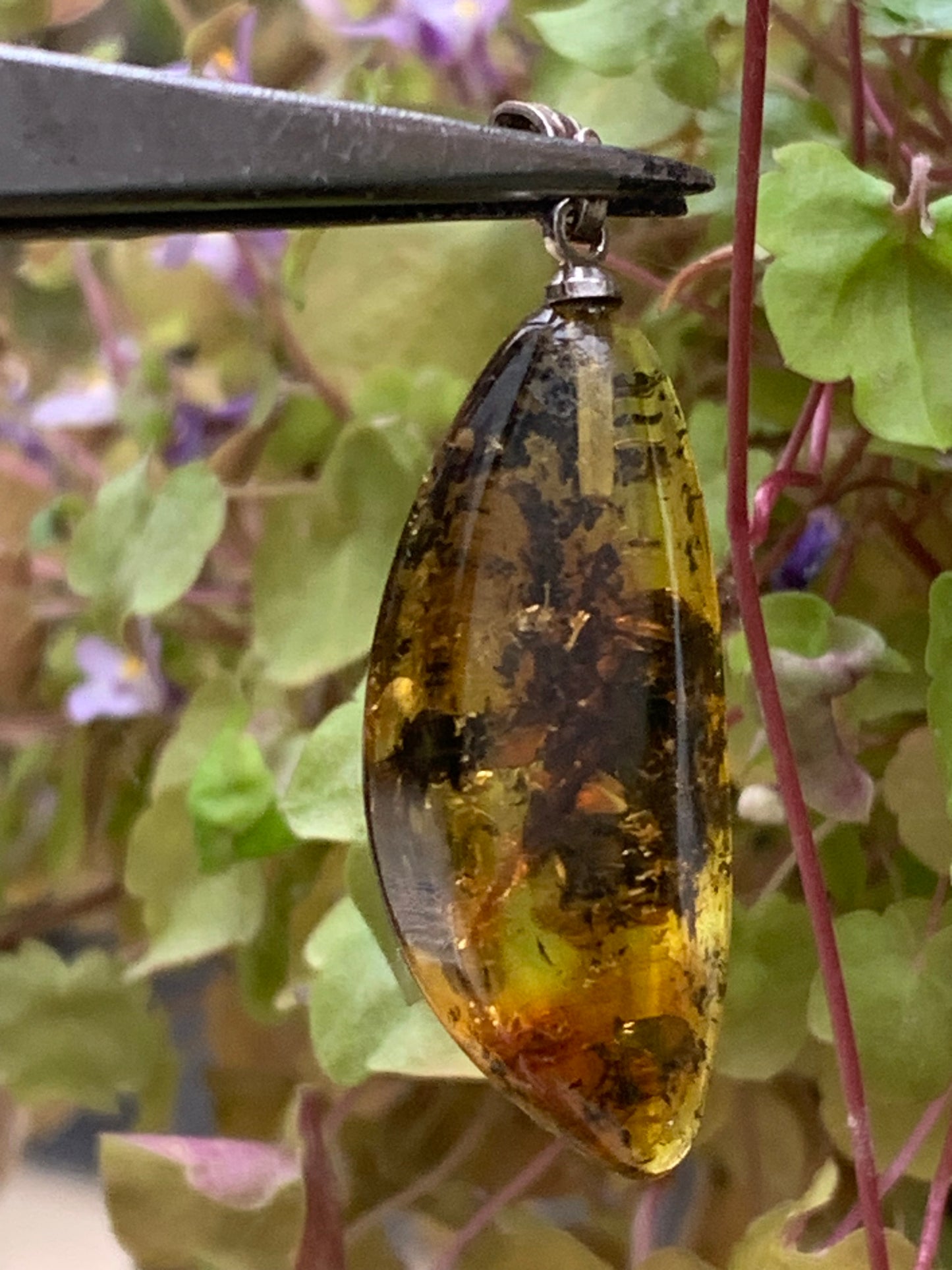 Amber, pendant measuring 40x13x9 millimeters, sold with a sliding (adjustable) black leather cord from 40 to 70 centimeters!