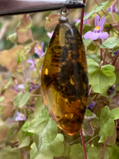 Amber, pendant measuring 40x13x9 millimeters, sold with a sliding (adjustable) black leather cord from 40 to 70 centimeters!